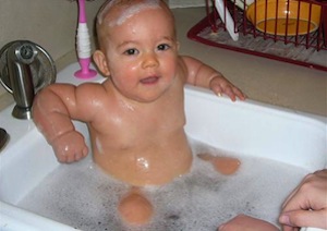 kid in a hot tub sink